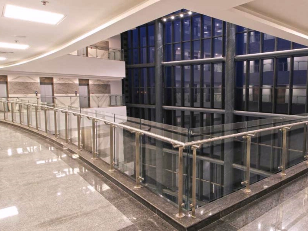 Reach 3 Roads Sector 70 modern commercial atrium with glass railings and premium marble flooring in Gurugram