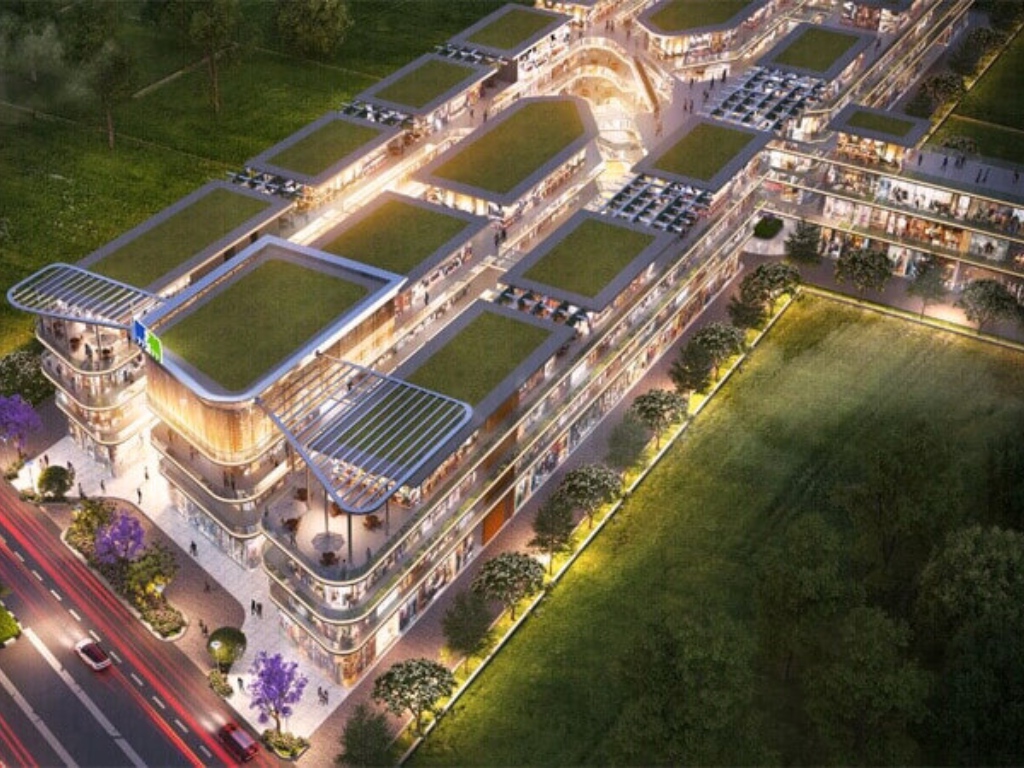 M3M Route 65 4 M3M Route 65 grand multi-level retail atrium with designer central fountain, skylit canopy, and premium shopping walkways in Sector 65 Gurugram