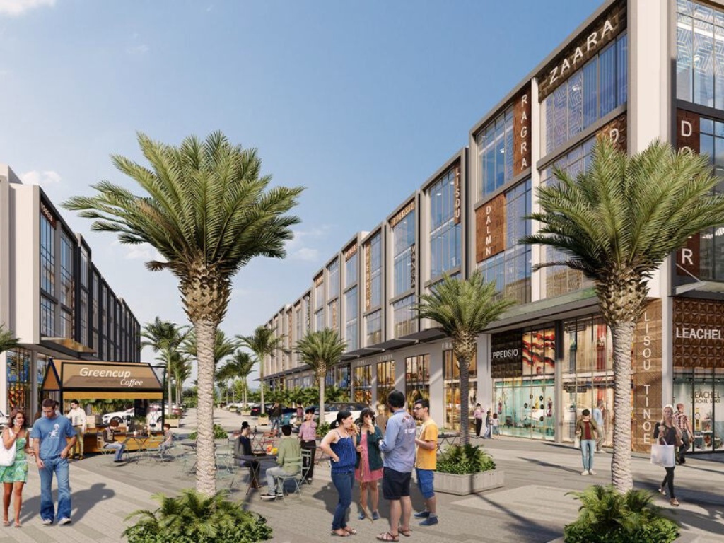 Reach Buzz 114 palm-lined commercial street with lifestyle retail outlets and pedestrian-friendly walkways
