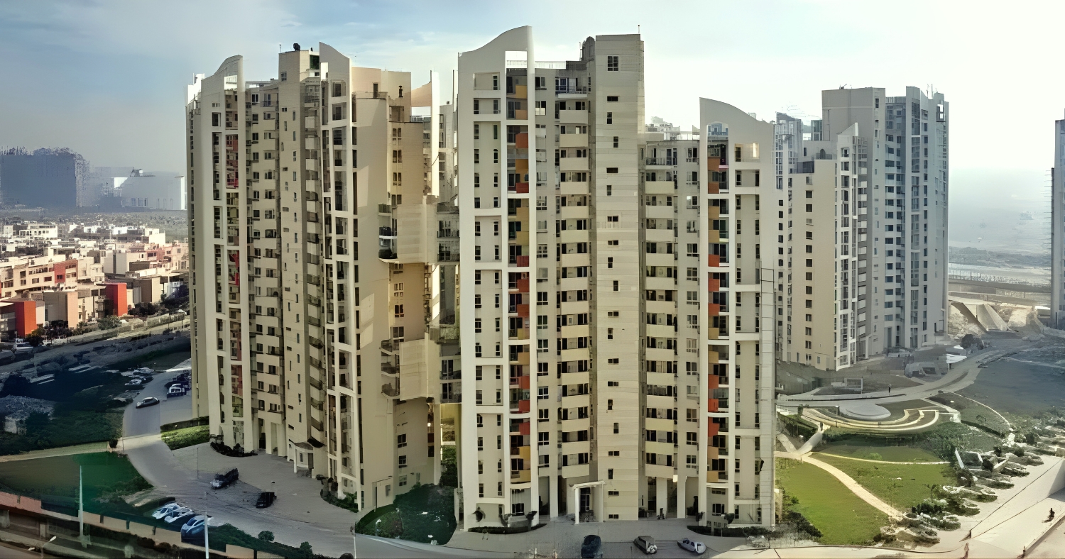 Premium residential towers in Nirvana Country Gurgaon surrounded by landscaped greens, representing upscale living in one of the posh areas in Gurgaon.