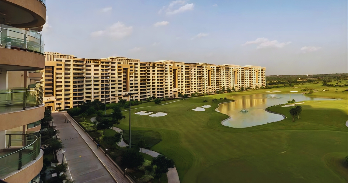 Golf-course-facing luxury residences in Ambience Island Gurgaon with lush green fairways and premium apartment towers.