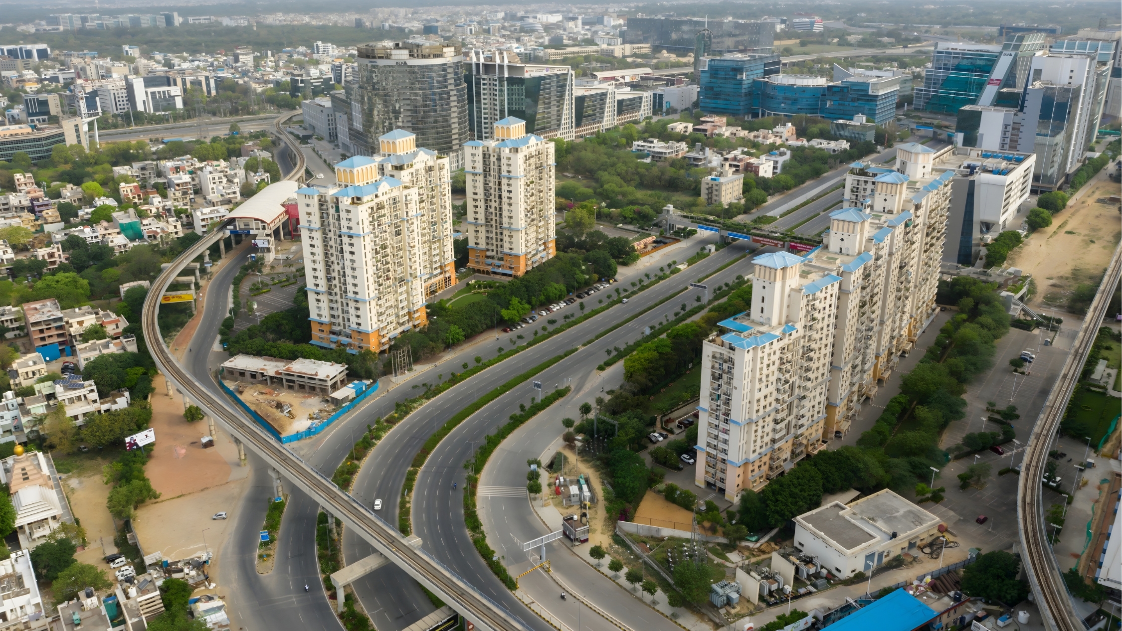 Golf Course Road Gurgaon aerial view showcasing luxury high-rise apartments, Rapid Metro connectivity, and premium commercial infrastructure.
